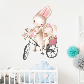 Autocolant pentru camera copilului Bunnies on a Bike - 60x30 cm